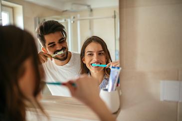 dental cleanings high point | couple brushing teeth