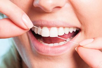 general dentist high point | person flossing teeth