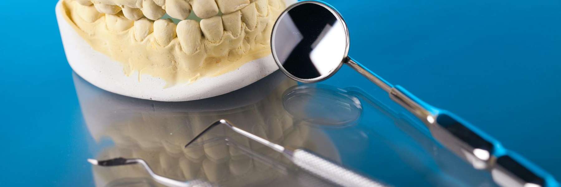An illustration of dental crowns and dental extractors at Deep River Family & Cosmetic Dentistry, 