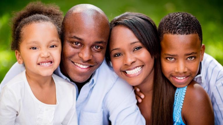 Couple and kids take a selfie after| family dentistry at Deep River Family & Cosmetic Dentistry