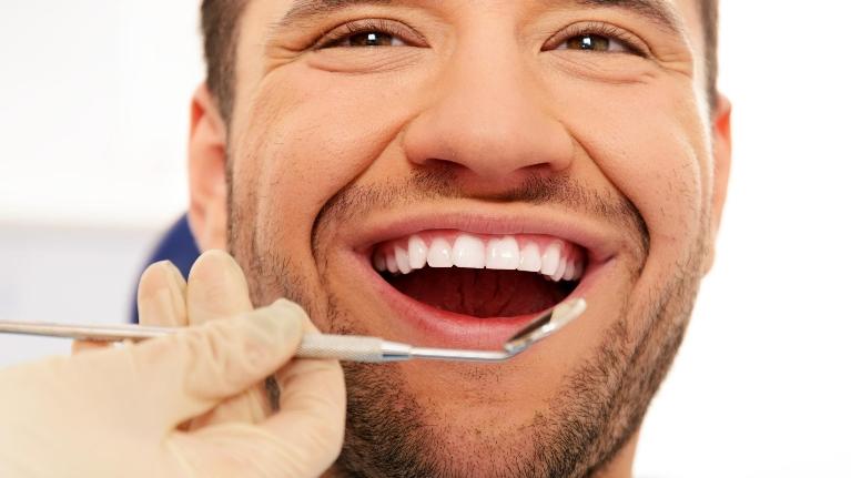 Patient smiling during dental examination at Deep River Family & Cosmetic Dentistry,