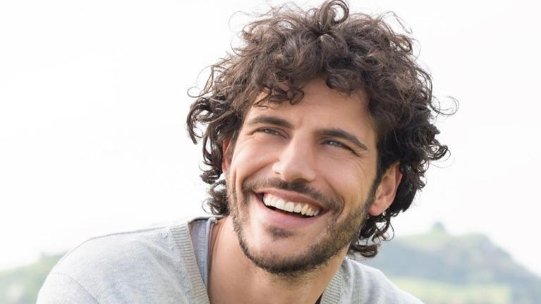 A man with dental implants in High Point, NC