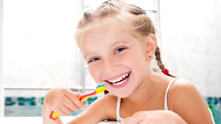Child brushing her teeth in High Point NC 