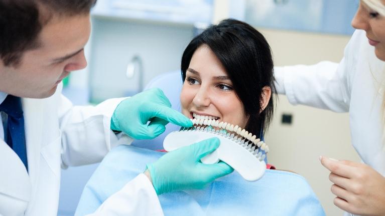 Dentists whitening patient's teeth at Deep River Family & Cosmetic Dentistry, 