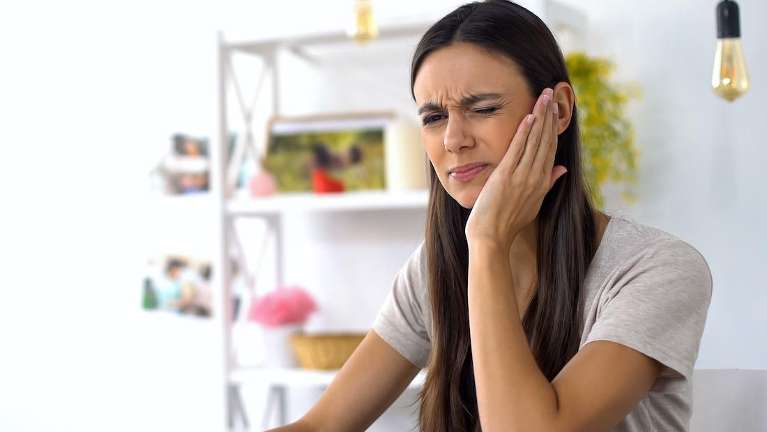 root canal high point | woman with tooth pain