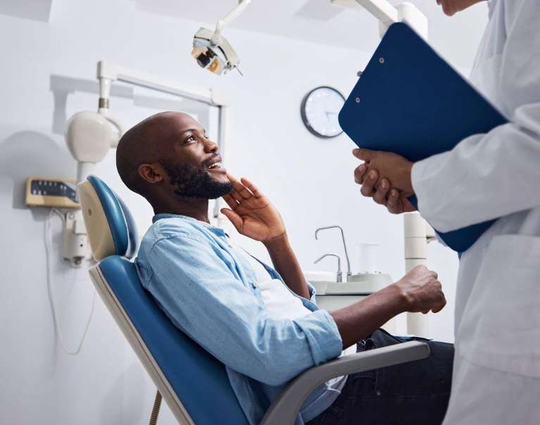 dental implants high point | man at dentist