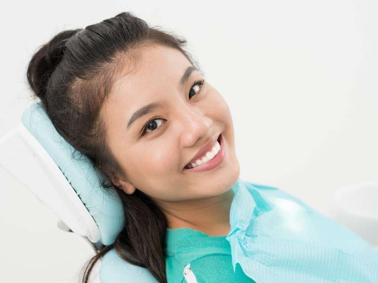 restorative dentistry high point | woman at dentist