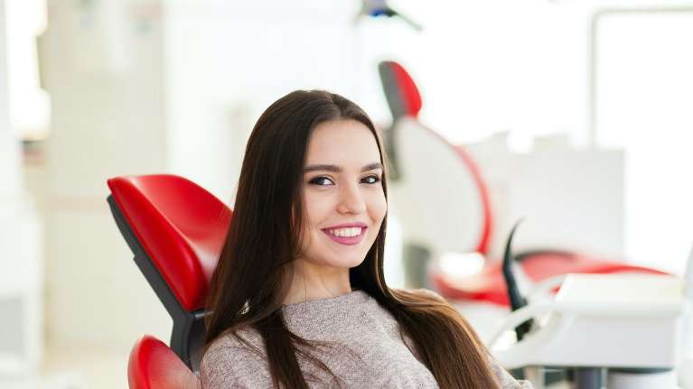 A lady smiling after dental check up in High Point, NC