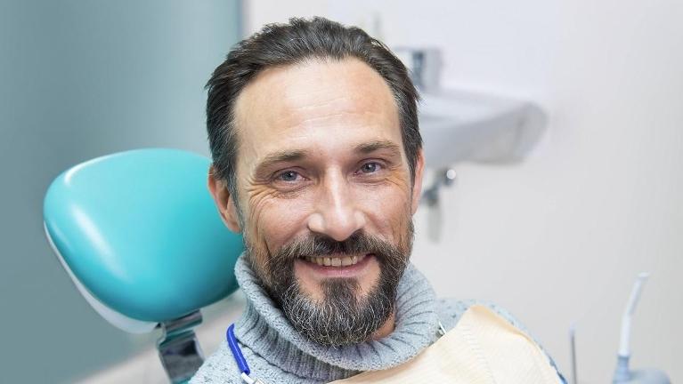 man at dentist getting dental implants in high point nc