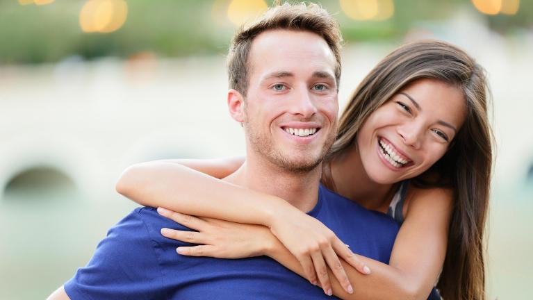 Young Couple Smiling after cosmetic dentistry in High Point, NC