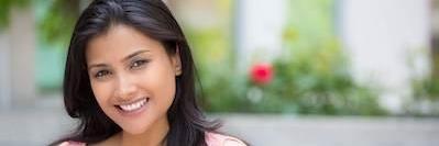 Lady smiling after teeth whitening at Deep River Family & Cosmetic Dentistry