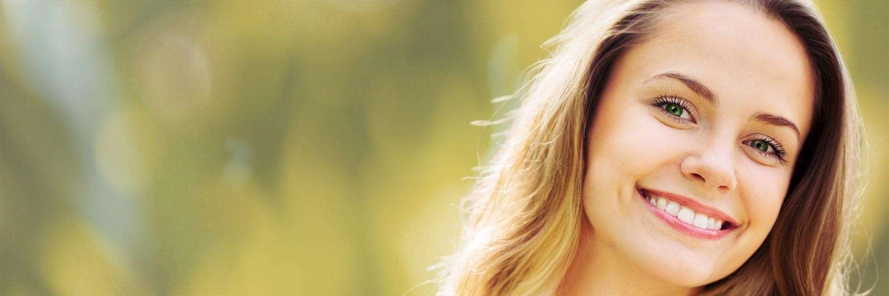 Lady smiling after professional teeth whitening in High Point, NC